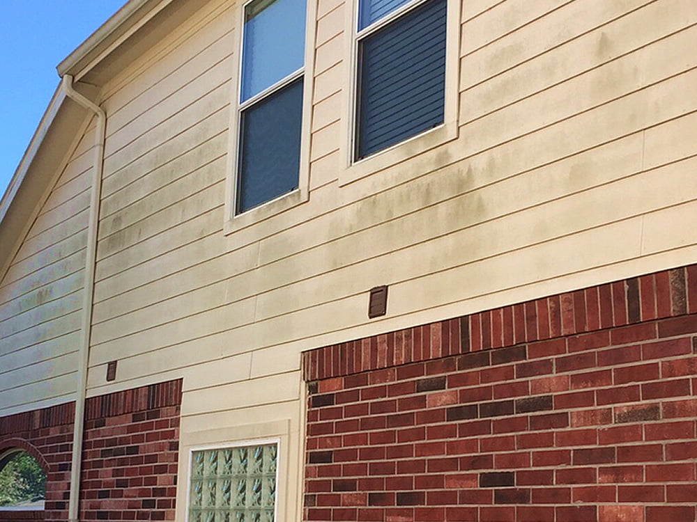 House siding before cleaning in Jacksonville, NC